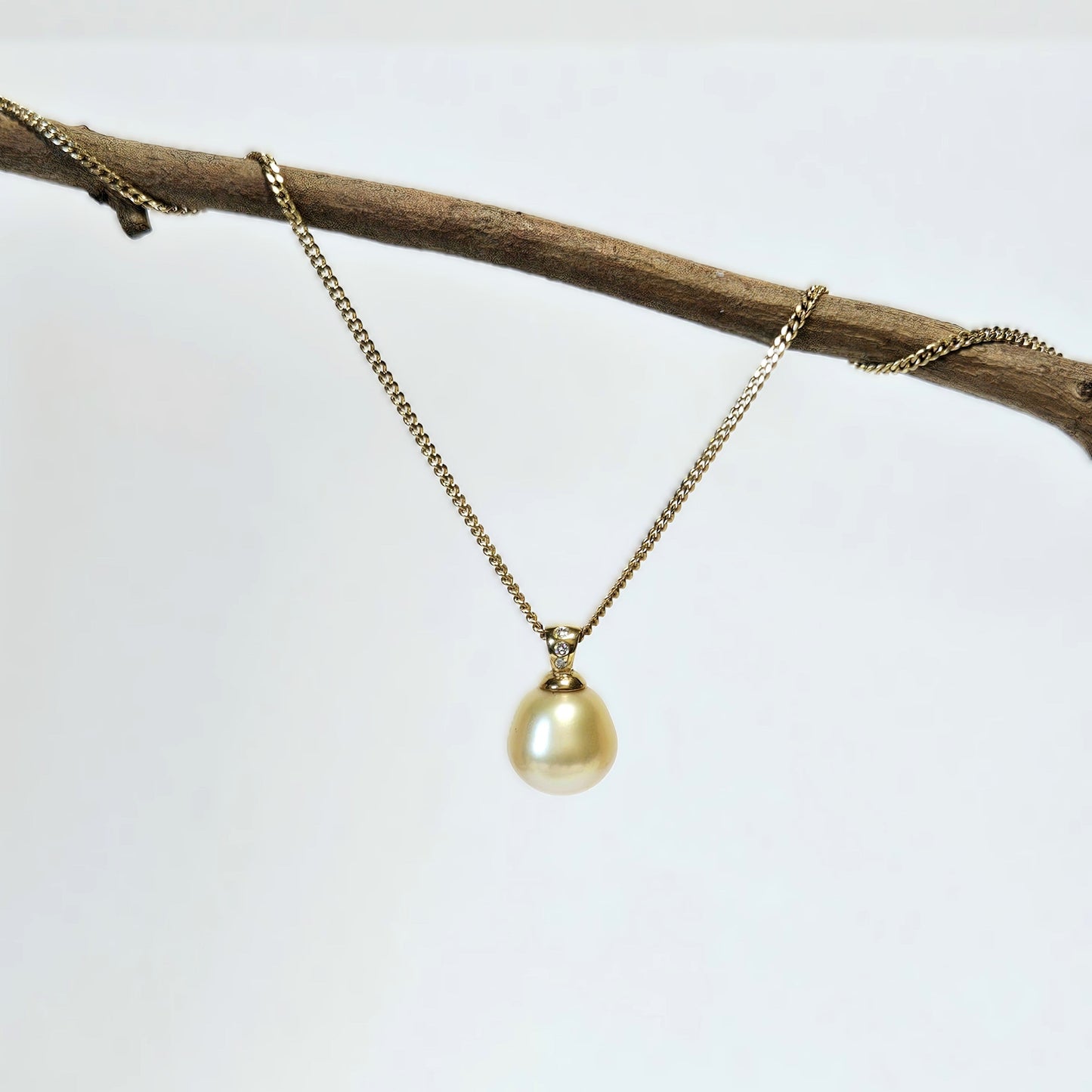 Golden pearl pendant