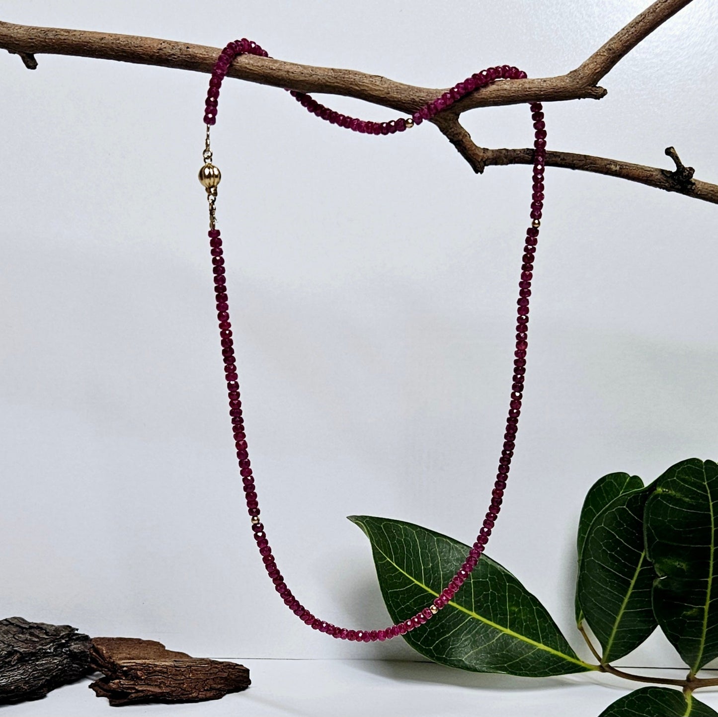 Ruby facetted bead necklet with gold spacers